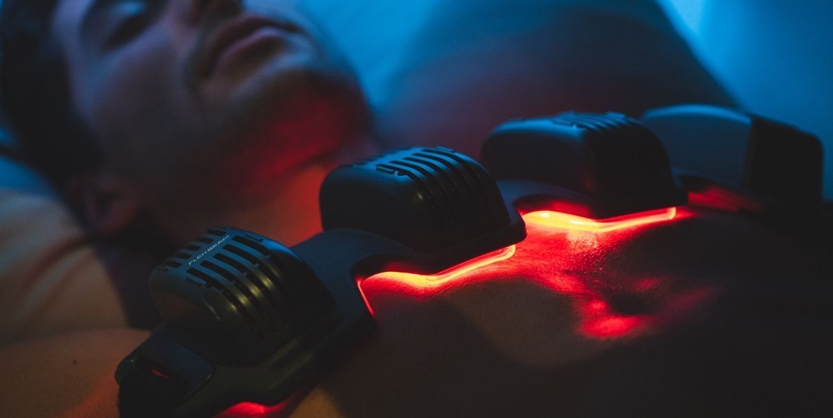 Photo of wearable red light therapy from FlexBeam being used at home.