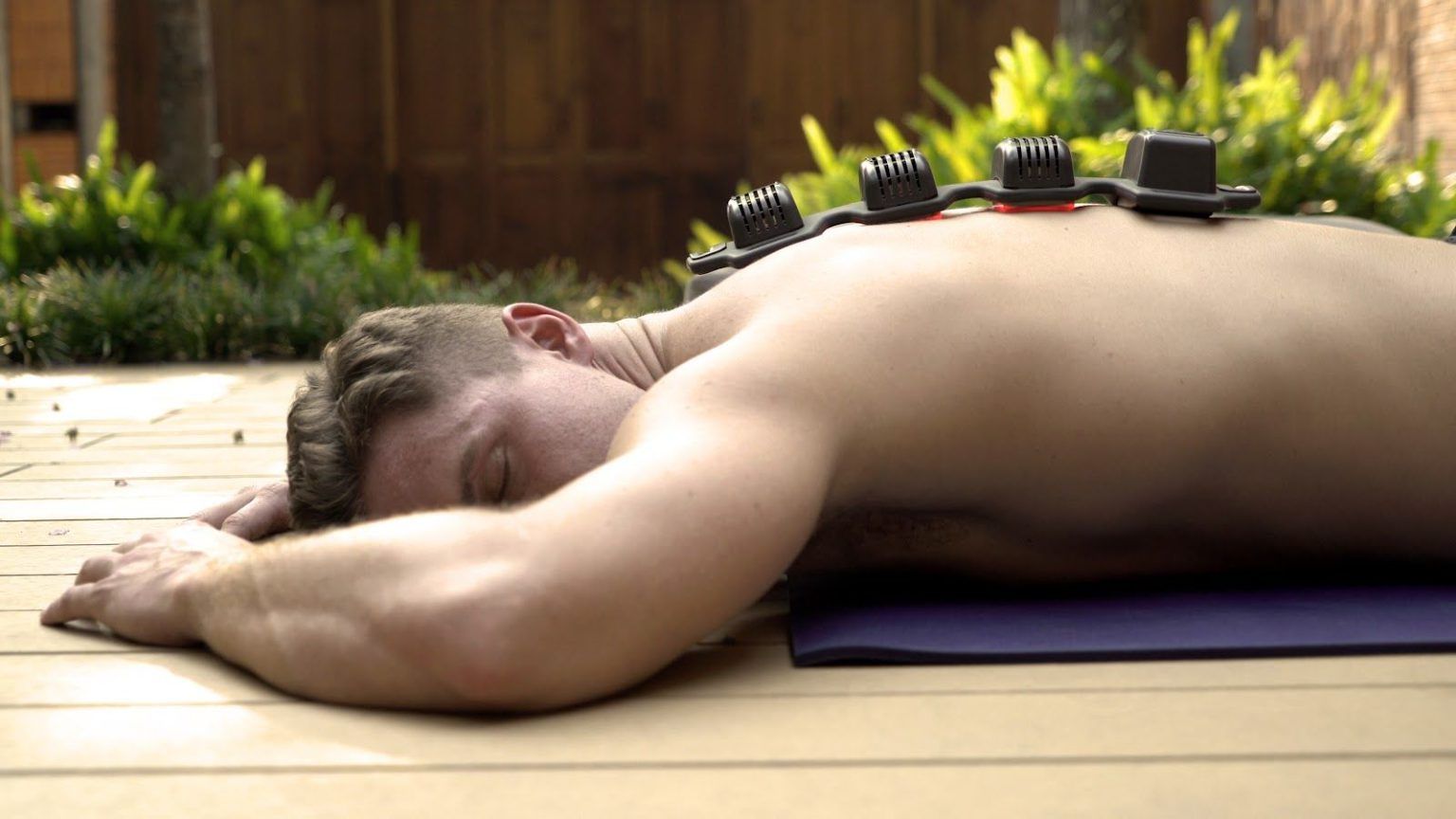 man grounding with flexbeam on his back