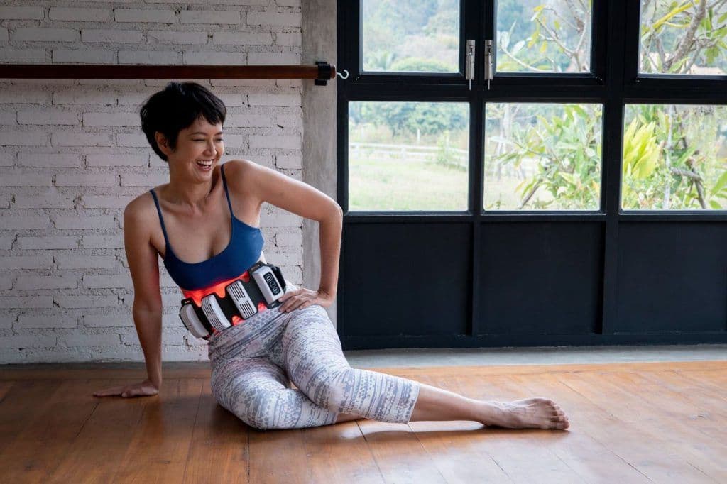 woman with flexbeam relaxing on the floor