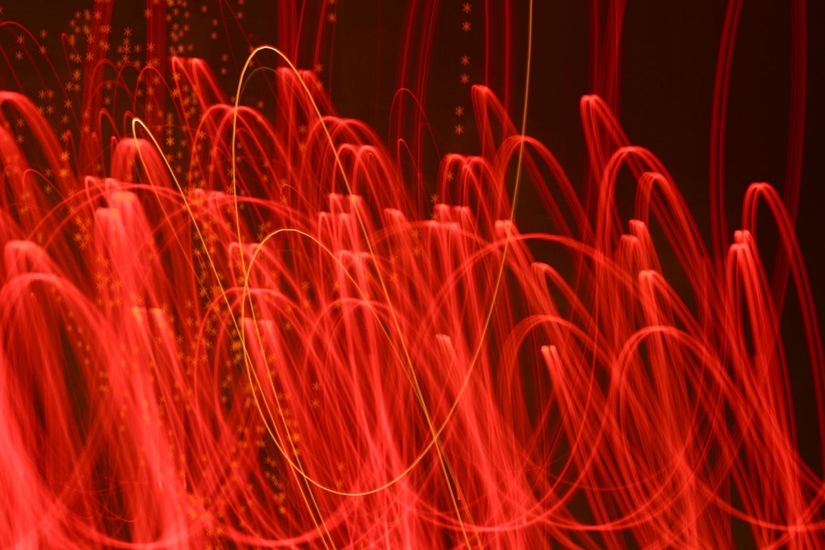 scribbles in red light can be seen against a dark background